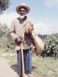 Old Haitian Man with His Rooster