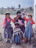 Mother and Four Children Wearing Derby Hats, Playing with Ball of Yarn, Andean Highlands of Bolivia
