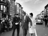 Sen. Jack Kennedy with Jackie, Walking Down Middle of the Street During Senate Re-Election Campaign