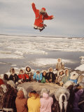 Buy Native Alaskans Playing a Game of Nulukatuk, in Which Individals are Tossed into the Air at AllPosters.com