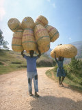 Haitian Man and Woman Carrying Large Baskets on their Heads