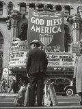 Buy Man with Shopping Bags in Front of Million Dollar Theatre Emblazoned with God Bless America Banner at AllPosters.com