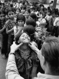 Buy Dr. Nevin S. Scrimshaw of the Central American Institute of Nutrition Examining Children for Goiter at AllPosters.com