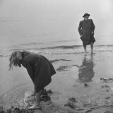 Buy Girl Playing in the Sand while an Older Woman Gets Her Feet Wet in the Ocean at Blackpool Beach at AllPosters.com