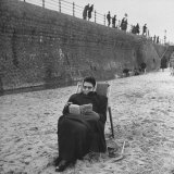 Buy Woman Wrapped up Tightly, Reading a Book on the Beach at AllPosters.com