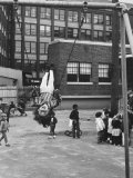 Child on Swings in Playground at the KLH Day Care Center