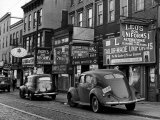 Buy Cars Parked in Front of Four Navy Uniform Stores on Sand Street at AllPosters.com