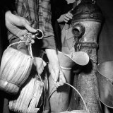 Civilians Filling Wine Jugs with Fresh Water after City was Restored in the Wake of Germans, WWII