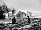 Two People Watching House Burn in Aftermath of Hurricane Hazel