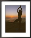 A woman doing yoga at sunrise on the East Cape of Baja, Mexico