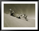 A group of hikers have a freefall down a sand dune near the Alsek River in Alas ka