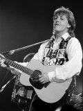 Paul McCartney Playing Guitar on Stage