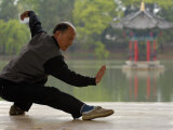 Man Doing Tai Chi Exercises at Black Dragon Pool with One-Cent Pavilion, Lijiang, China