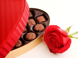 Studio Shot of Box of Romantic Chocolates and Red Rose