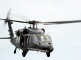 HH-60 Pave Hawk Helicopter Conducts Search and Rescue Operations Photographic Print