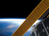 Buy Solar Array Panels on the International Space Station Backdropped Against Earth's Horizon at AllPosters.com