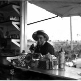 Young Man at Outdoor Food Stand Drinking a Coke