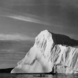 Buy Native Man in Kayak Sitting in Water Next to Iceberg at AllPosters.com