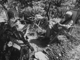 Buy Poet Ezra Pound with Lover Olga Rudge, Chatting in Lounge Chairs Next to Breakfast Food in Garden at AllPosters.com