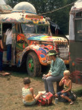 Man Seated with Two Young Boys in Front of a Wildly Painted School Bus, Woodstock Music Art Fest