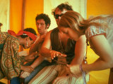 Two Women Giving Medical Care to Men, During the Woodstock Music and Art Fair