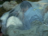 Youths Huddled under a Piece of Clear Plastic in the Rain, Woodstock Music and Art Fair