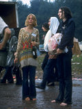 Couple Standing Barefoot on a Road Holding a Bundle and Wine Bottle, Woodstock Music and Art Fair