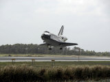 Space Shuttle Discovery Approaches Landing on the Runway at the Kennedy Space Center