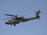AH-64 Apache in Flight over the Baghdad Hotel in Central Baghdad, Iraq Photographic Print
