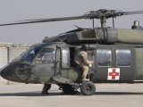 Buy UH-60 Blackhawk Medivac Helicopter Refuels at Camp Warhorse after a Mission at AllPosters.com