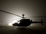 Illumination from the Bright Light Silhouettes of OH-58D Kiowa Helicopter During Thick Fog Photographic Print
