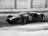 Pilot Driving a Racing Car in a Race Photographic Print