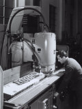 Worker Operating a Machine in the Ferrari Factory