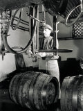 Worker in Front of Some Isobarometric Equipment Inside a Brewery