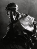 Half-Length Portrait in Profile of a Motor Cyclist with Leather Jacket and Helmet
