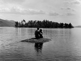 Buy Private Island, Young Couple Embracing on a Small Rock Protruding from the Waters of Lake George at AllPosters.com