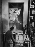 Buy Lab Attendant Taking Detergent Shower before Entering Germicide Tank, Notre Dame University at AllPosters.com