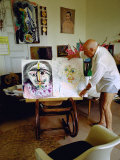 Buy Pablo Picasso Arranging Displays of His Paintings at His Home in Notre-Dame-De-Vie, Mougins at AllPosters.com