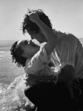 Actress Terry Moore Hugging Actor Robert Wagner on the Beach