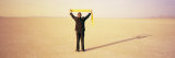 Businessman Measuring the Sky with a Tape Measure, Black Rock Desert, Nevada, USA
