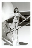 Stewardess Balancing on Plane Wheel