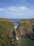Figures Crossing Carrick-A-Rede Bridge over Cove, County Antrim, Ulster, Northern Ireland, UK