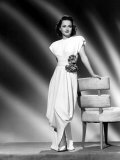 Buy Olivia De Havilland in a Harem-Type Draped Dinner Dress, 1946 at AllPosters.com