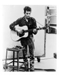 Bob Dylan Playing Guitar and Harmonica into Microphone. 1965