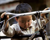 Buy Little Boy with Bike, China at AllPosters.com
