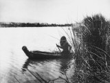 Buy Pomo Indian Poling His Boat Made of Tule Rushes Through Shallows of Clear Lake, Northen California at AllPosters.com