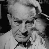 Artist/Illustrator James Montgomery Flagg Studying a Model before Painting Her