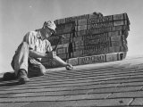 Buy Carpenter Putting Roof on New House That Is Part of a Housing Project at AllPosters.com
