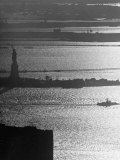 Buy Moonlight on the Waters Surrounding Statue of Liberty as a Tug Boat Steams Past in New York Harbor at AllPosters.com