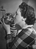 Mrs. Martini, Wife of the Bronx Zoo Lion Keeper, Kissing a Tiger Cub